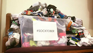 Bin of socks for offering